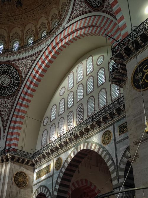Free Detailed view of the ornamented interior of a mosque in Istanbul, highlighting arches and window designs. Stock Photo