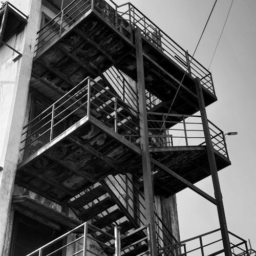 Grayscale Photo of Staircase