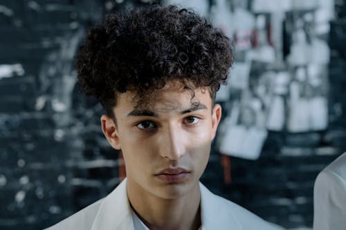 Close-up of a Young Man with Curly Hair