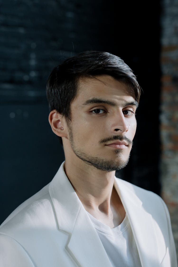 Portrait Of A Young Man In A White Outfit