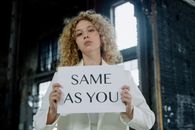A Woman Holding a Printed Paper