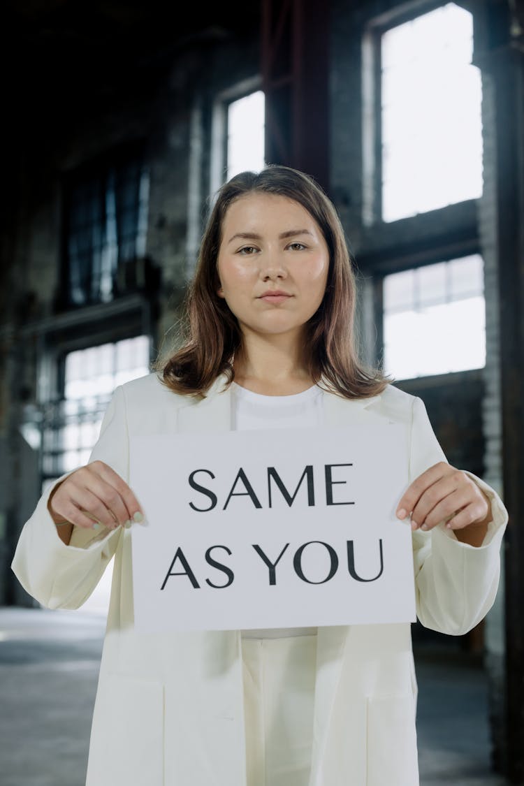 Woman Holding A Paper With Same As You Message 