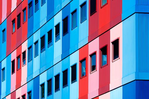 Free Vibrant modern architecture facade with red and blue panels. Stock Photo