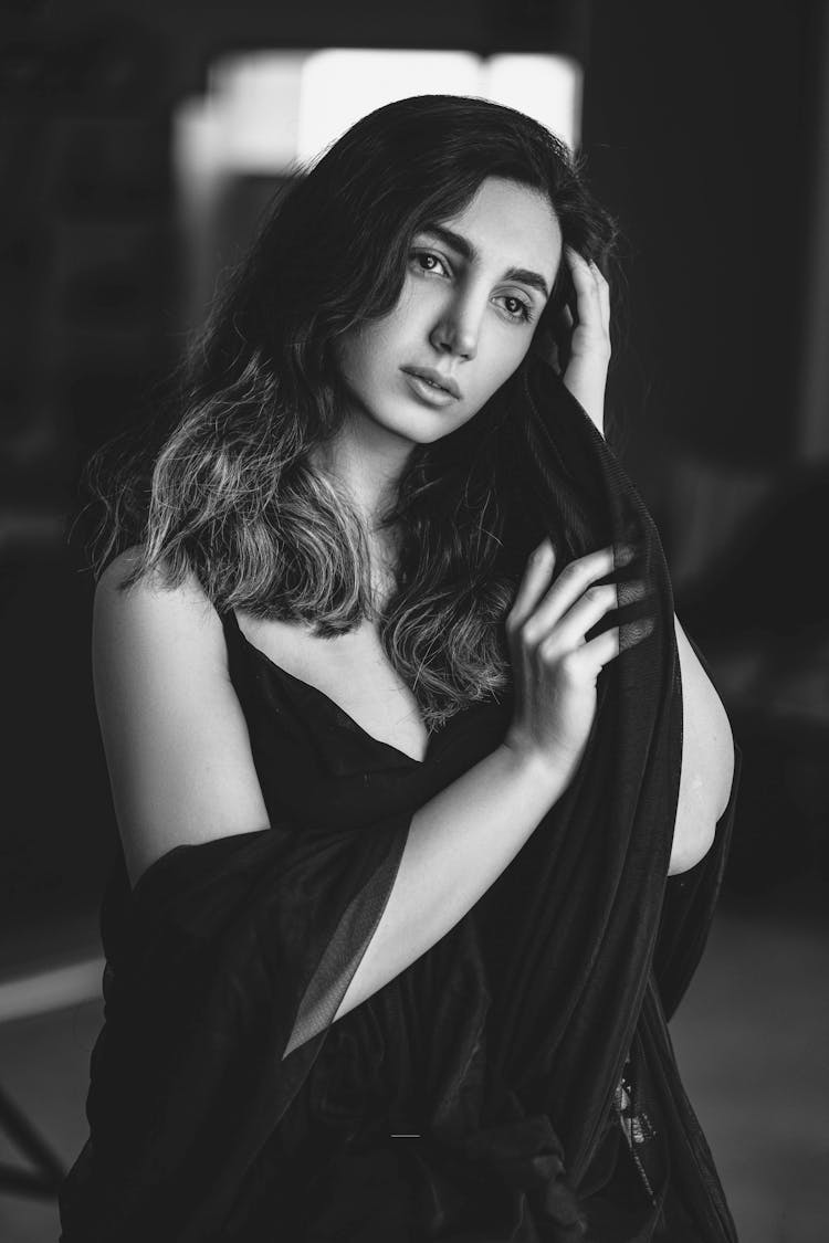 Beautiful Woman With Long Dark Hair Wearing Airy Dress Looking Thoughtful