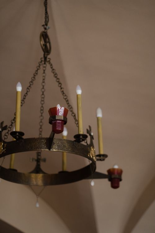 Free Intricate antique chandelier hanging in a traditional church setting, highlighting religious ambiance. Stock Photo