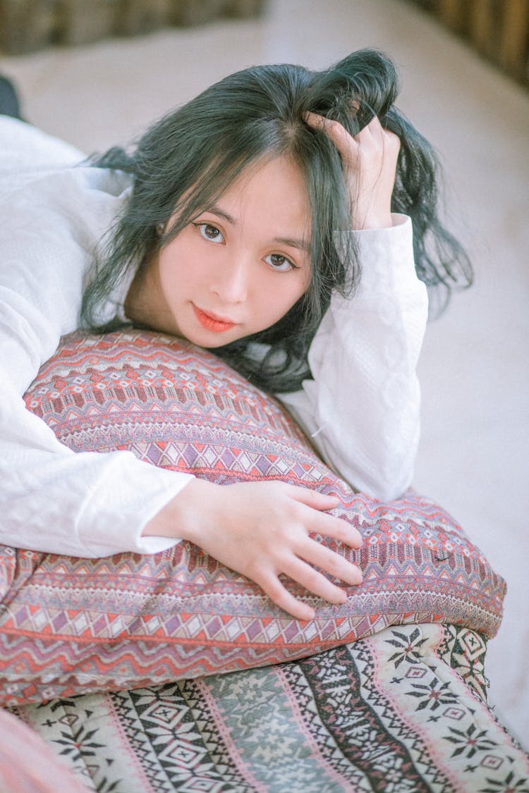 Woman With Dyed Hair Lying On Pillow