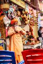 Bearded Man Standing Near the Hanging Woven Baskets