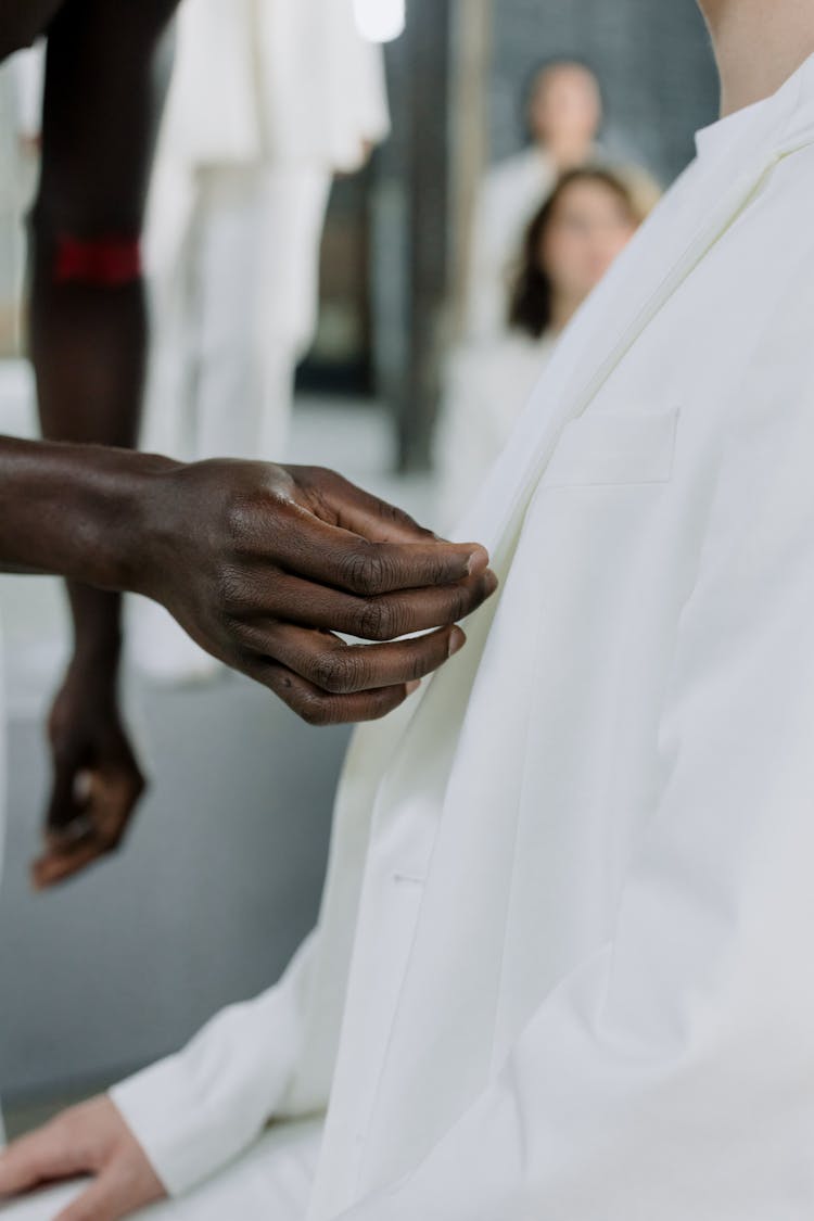 Man Hand Touching Other Man Suit