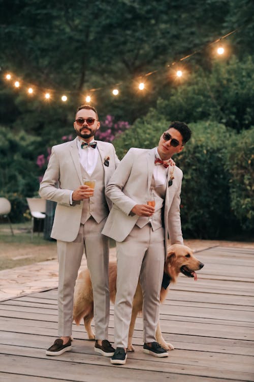 Free Boyfriends in Suit Wearing Sunglasses Petting Dog Stock Photo