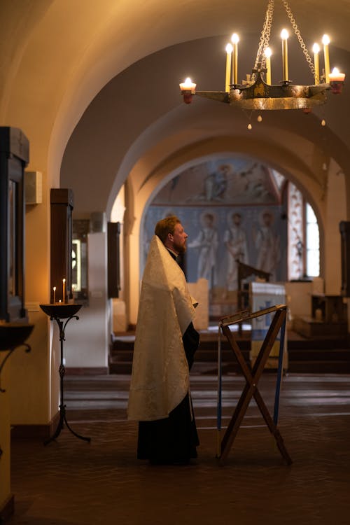 Orthodox Priest Standing by Lectern in Church