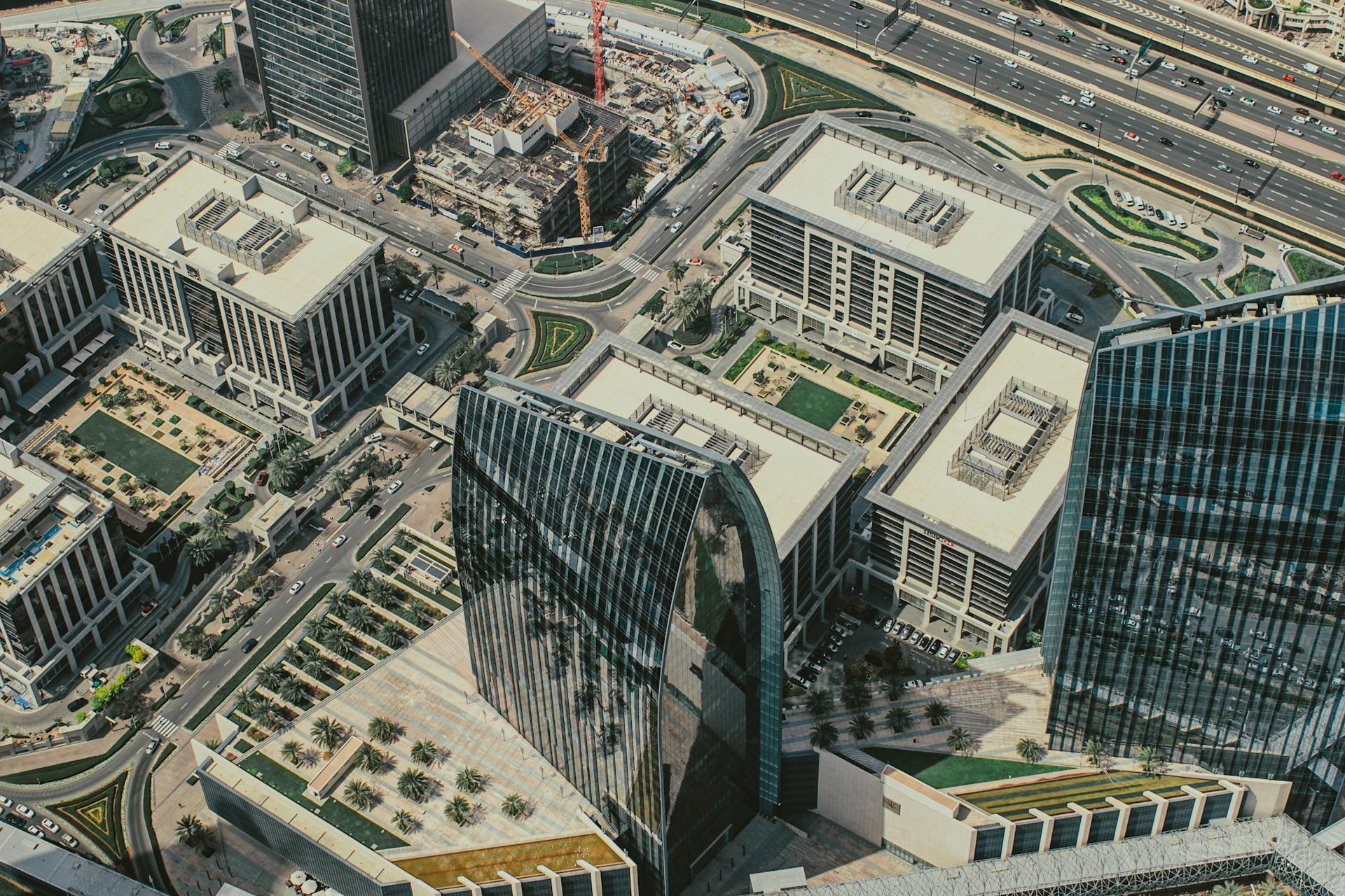 A stunning aerial capture of Dubai's modern business district with prominent skyscrapers.