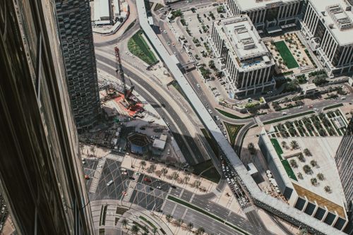 Free Overhead capture of Dubai's bustling downtown showcasing roads and modern buildings. Stock Photo