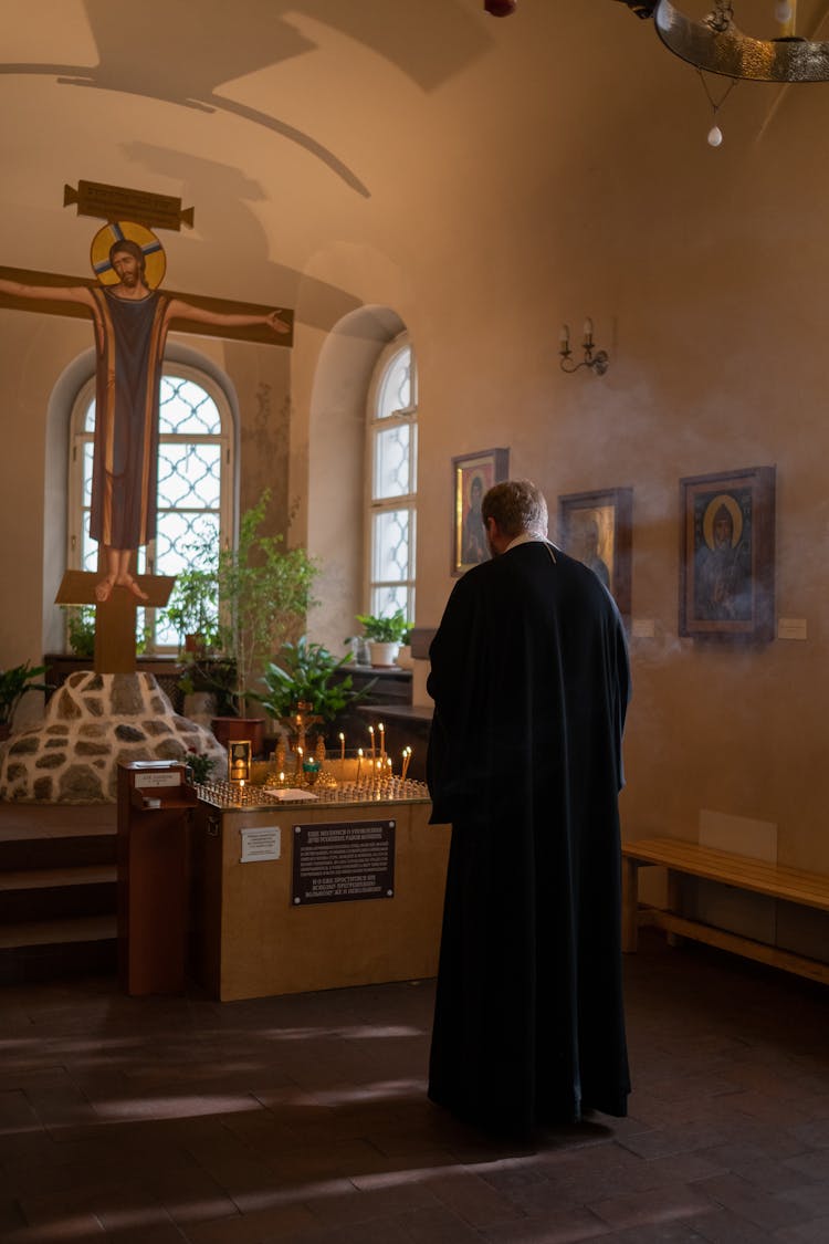 A Priest In A Chapel