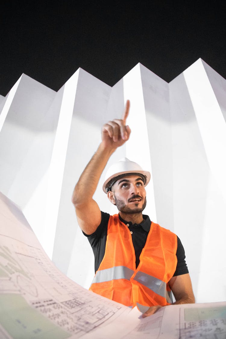 Worker In Helmet And Vest