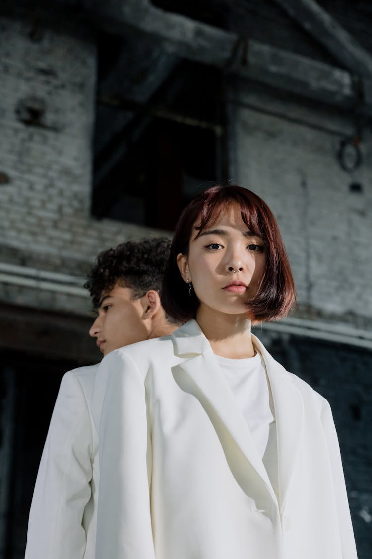 A Low Angle Shot Of A Woman In White Blazer