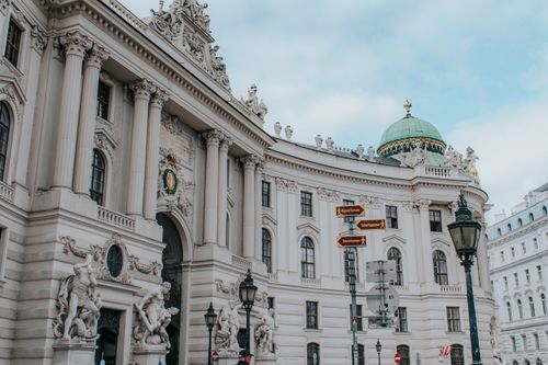 Free View of The Hofburg Palace with intricate sculptures and architecture in Vienna, Austria. Stock Photo