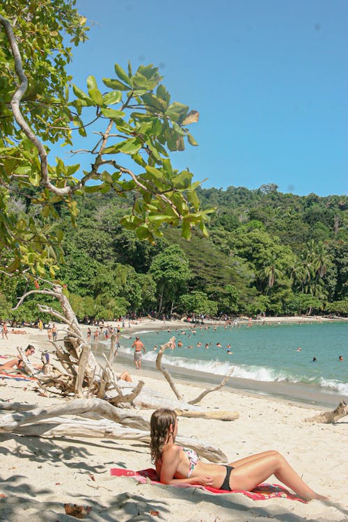 A Woman Lying on the Beach Sand