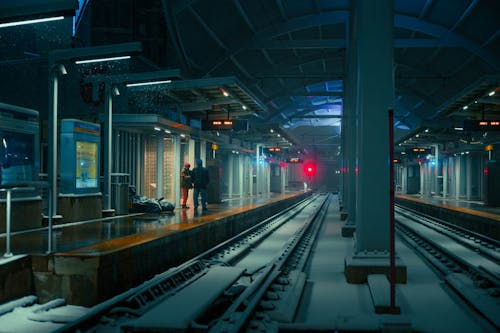 People Waiting on Platform of  Train Station