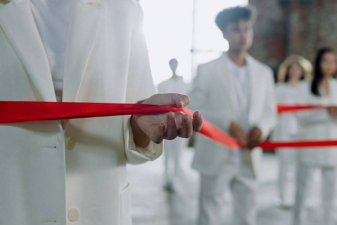 Hand Holding Red Ribbon · Free Stock Photo