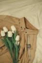Brown Denim Jeans With White Flowers