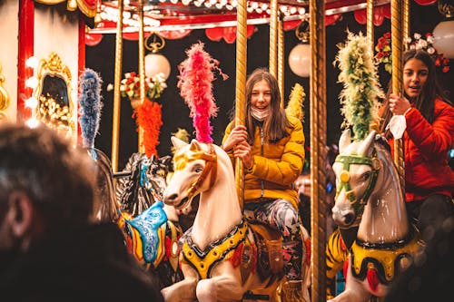 Young Women riding a Carousel