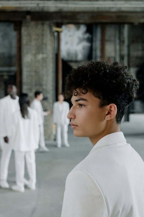 Close-up Shot of a Man in White Suit 