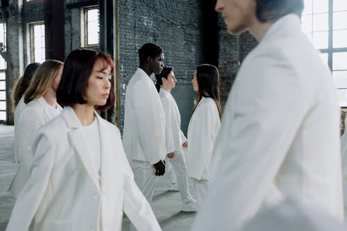 Walking Models in White Suits