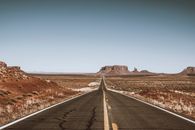 Empty Road Crossing Monument Valley, Utah, USA