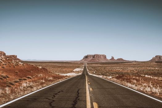 Empty Road Crossing Monument Valley, Utah, USA