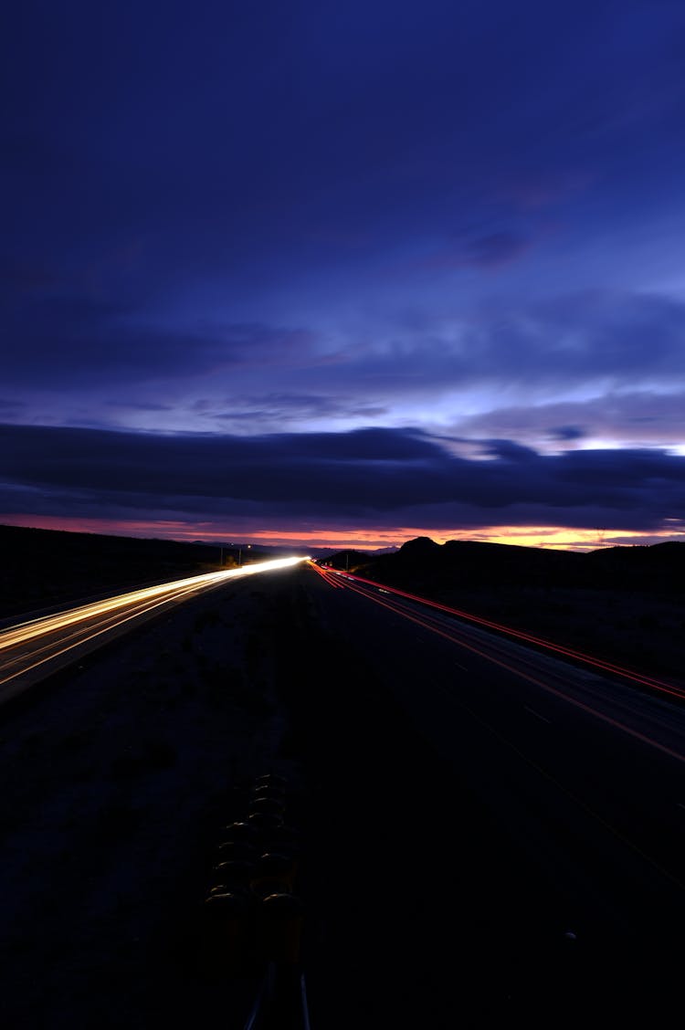 Long Exposure Photography Of Road During Sunset