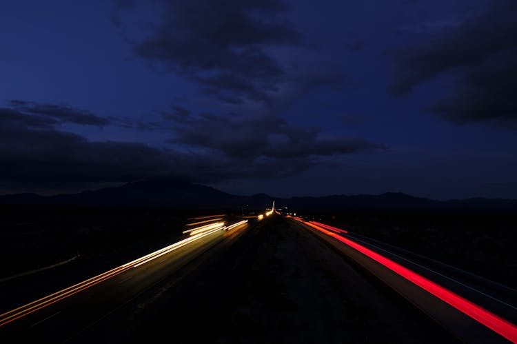 Blurred Car Lights On A Road At Dusk