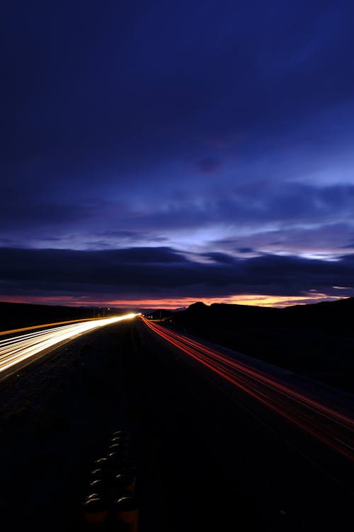 Lights of Cars on Road in Evening