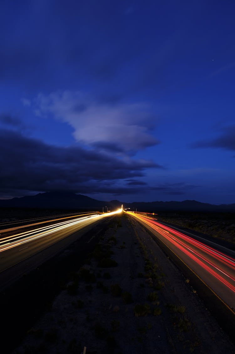 Road With Blurred Car Lights At Dusk