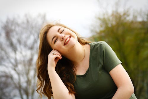Woman in Green Shirt Smiling