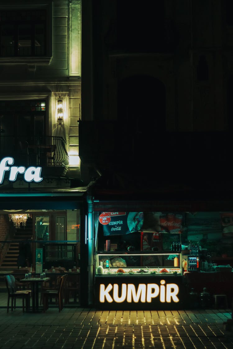 Street Food Stall Next To Restaurant At Night