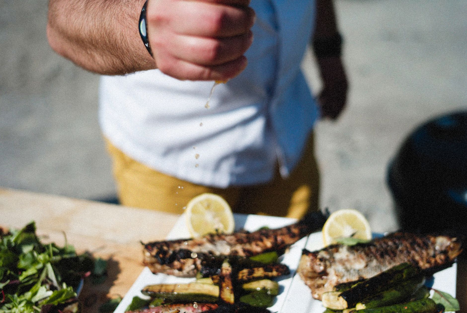 Grilled branzino with lime and basil on a platter
