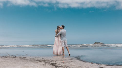 Free Couple Kissing on Beach Stock Photo