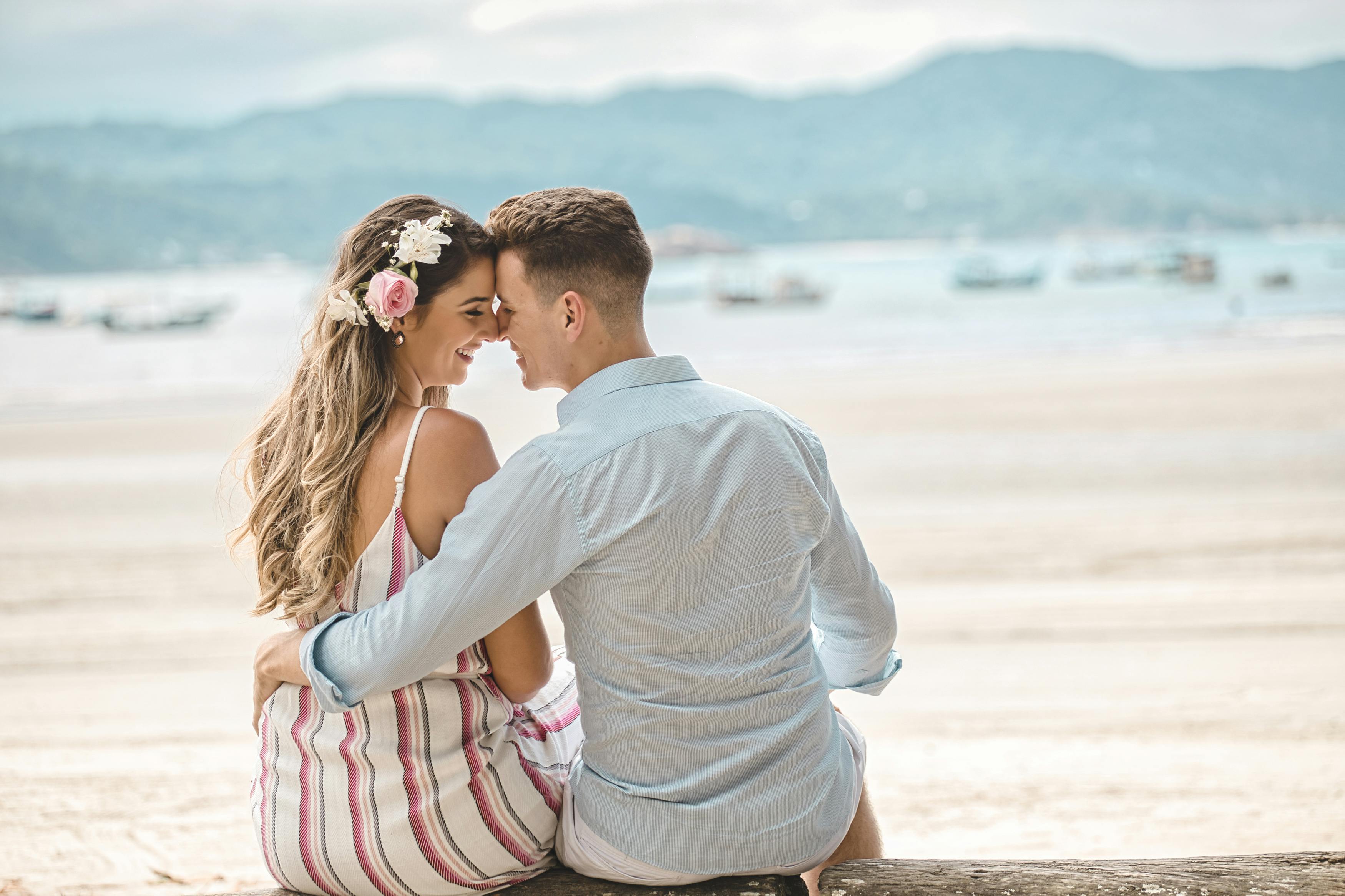 A Couple Sitting while Doing Face to Face · Free Stock Photo