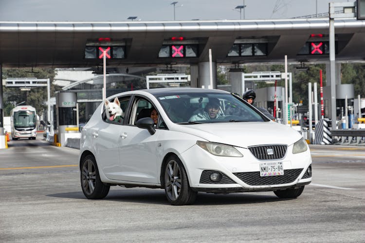 A White Car Moving On The Road