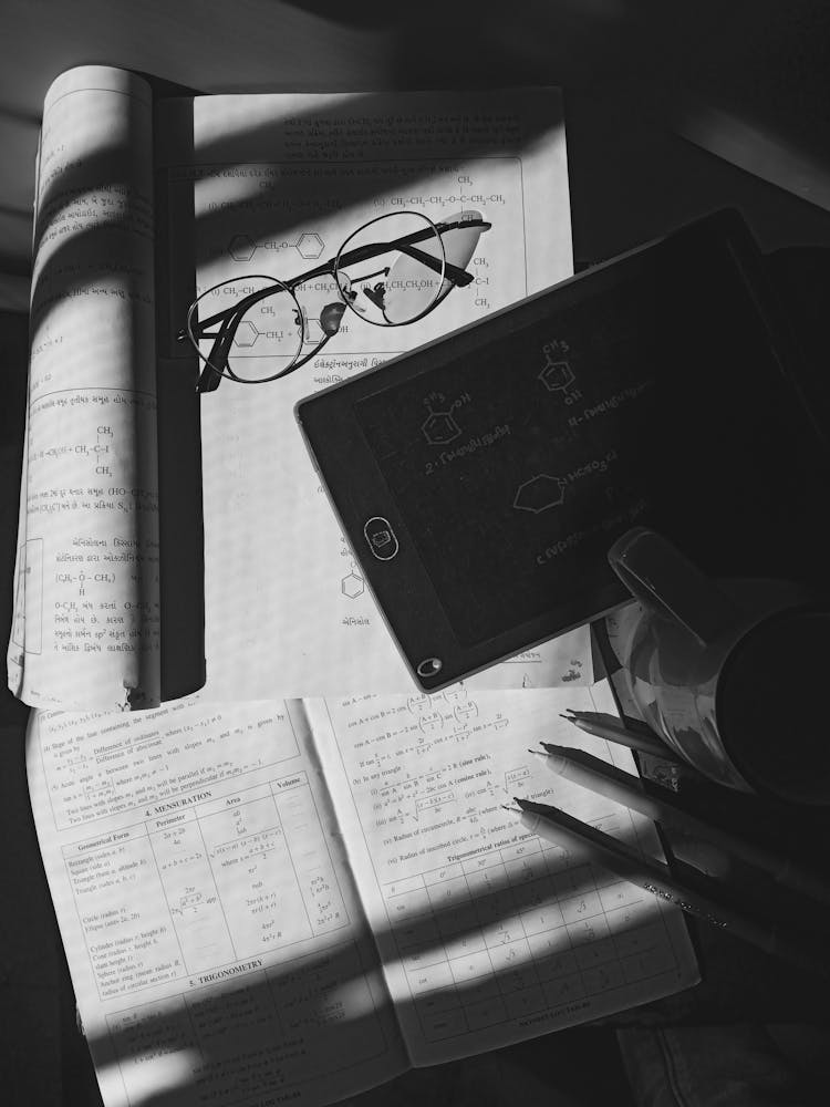 Book, A Notebook, Eyeglasses And A Mug