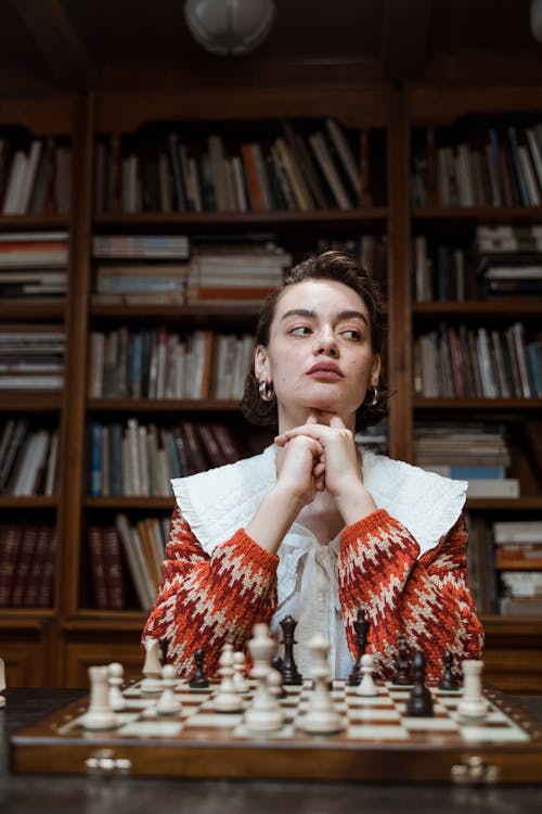 A Woman Sitting with Her Hands on Her Chin