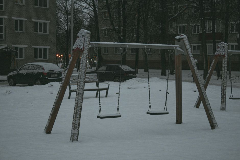 empty swing set playground overcast