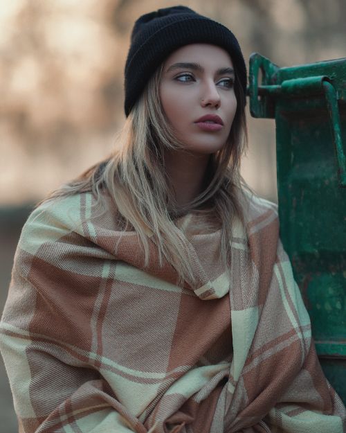 Free Portrait of a woman in warm clothing outdoors in Moscow during winter. Stock Photo