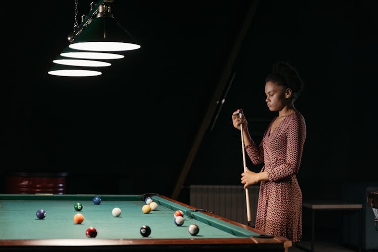 A Woman Playing Billiards