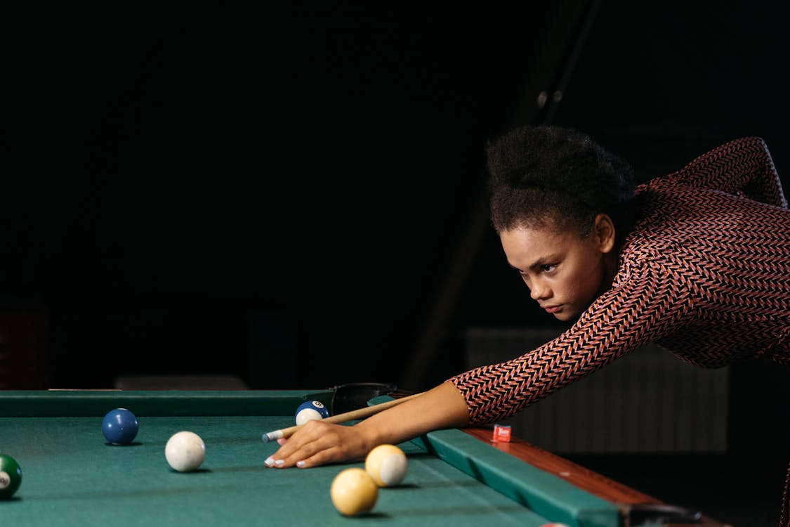 A Woman Playing Billiard