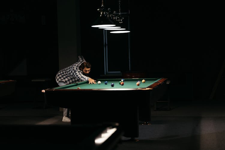 Man Playing Billiards