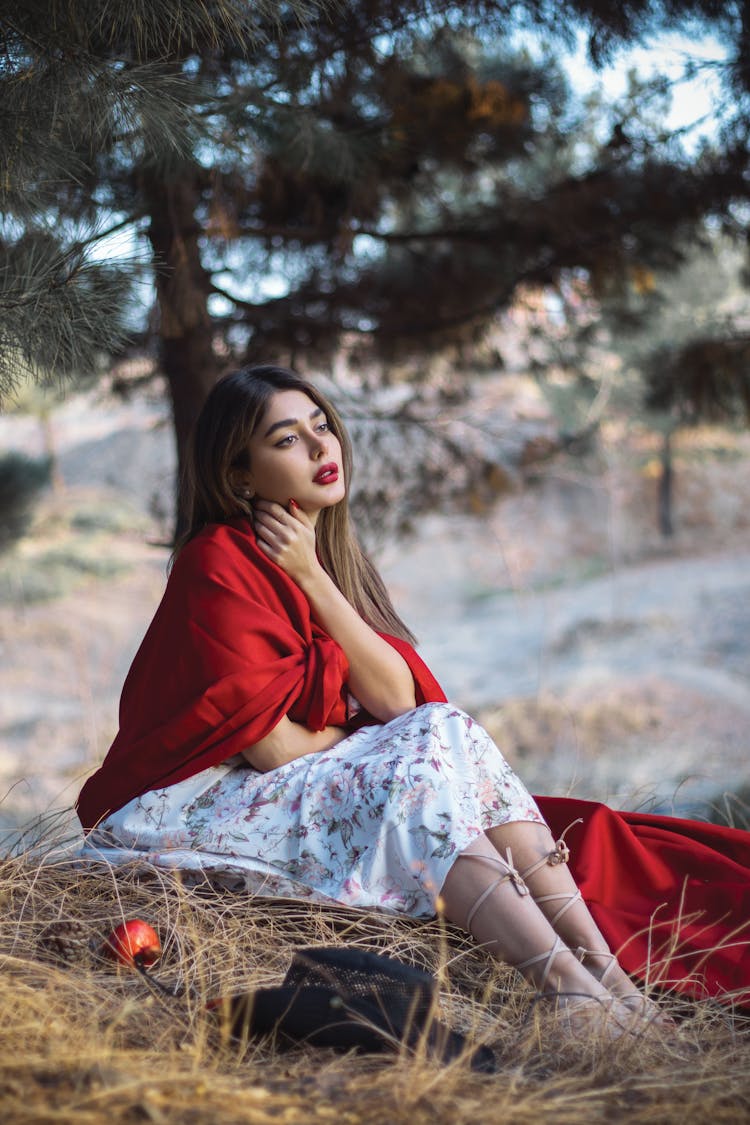 Woman Wearing Lipstick Touching Her Neck 