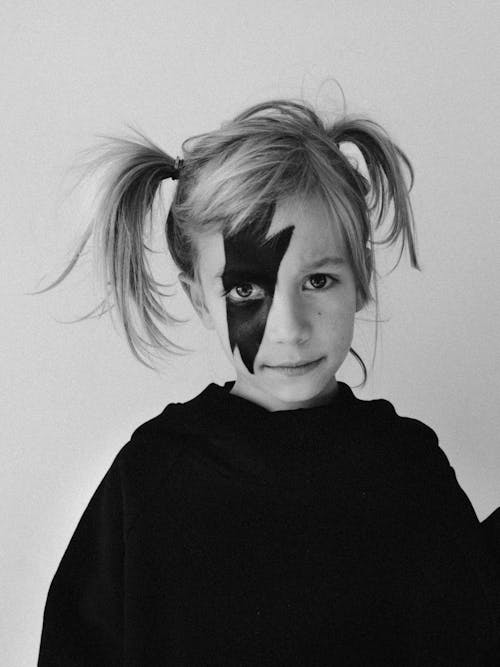 Free Grayscale Photo of a Girl with Face Paint Stock Photo