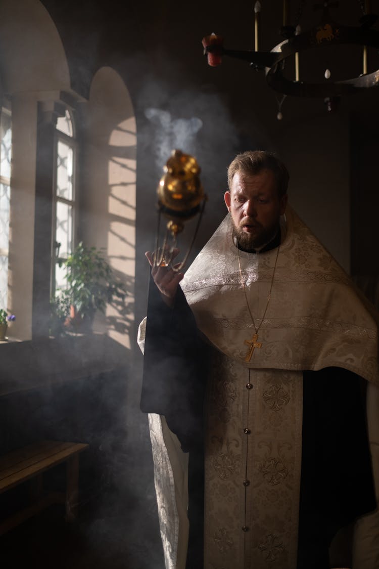 Orthodox Priest Holding Incense