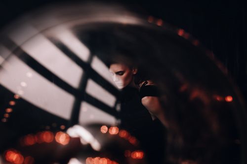 Free A captivating abstract portrait of a woman with unique lighting and reflections. Stock Photo